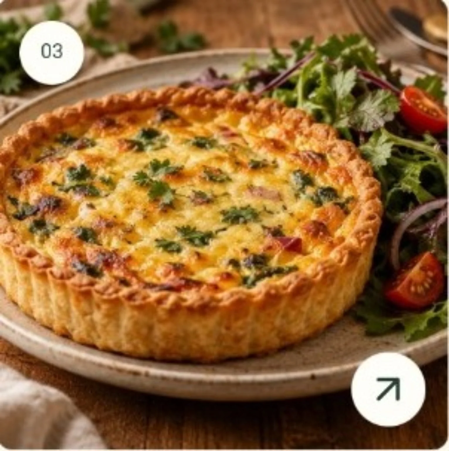 Inspiration photograph of a golden savory quiche with salad